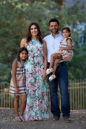 Family-Portrait-with-Girls-in-Matching-Plaid-Dresses